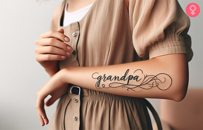 A grandpa inscription tattoo on the forearm